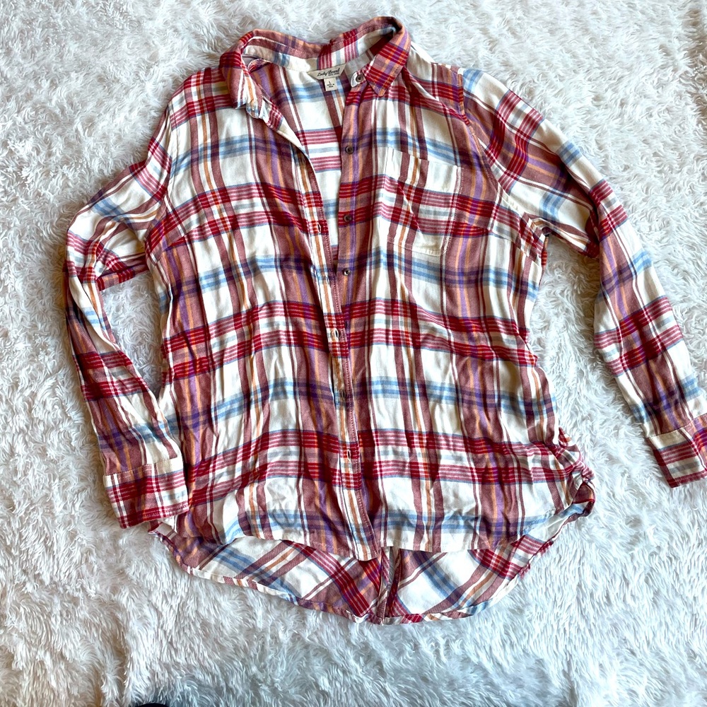 Flannel with button detail on the lower half of the back